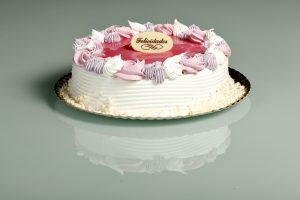 Tarta latina con glaseado rosa suave y relleno a elegir.