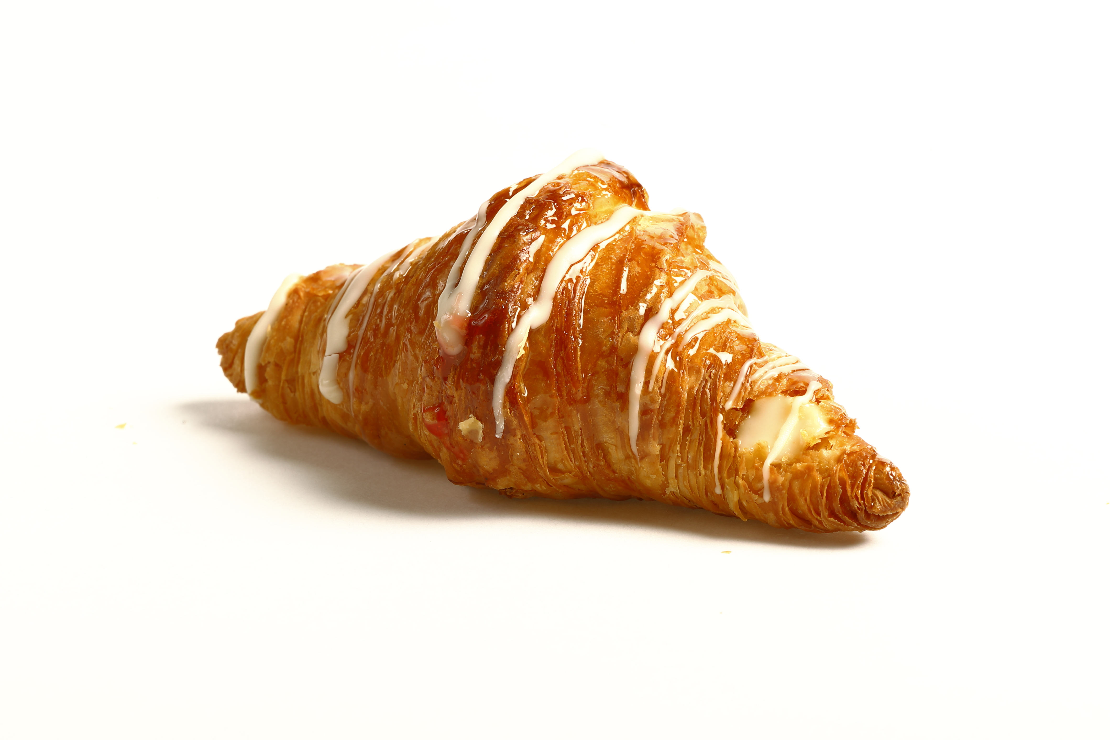 Mini croissant relleno de crema de limón con masa hojaldrada dorada.